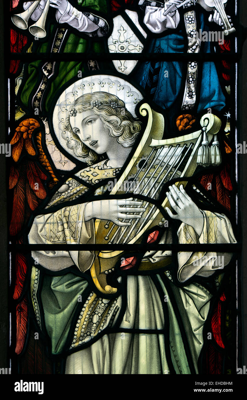 Angel musician stained glass, St Barbara`s Church, Ashton under Hill, Worcestershire, England, UK Stock Photo